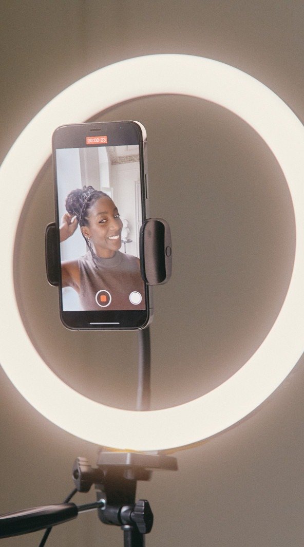 A phone on a ring light stand, recording a practice run